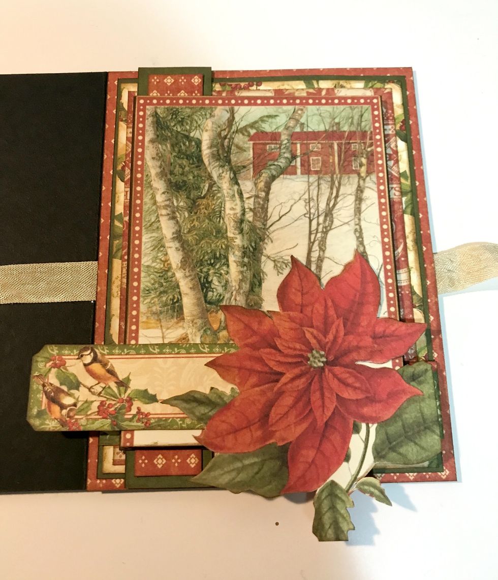 Adhere 3/4" red diamond paper to the 1" green paper. Adhere 1" green paper 3/8" from left of diamond paper. Adhere image to brown paper. Foam square brown paper to middle of red border paper.