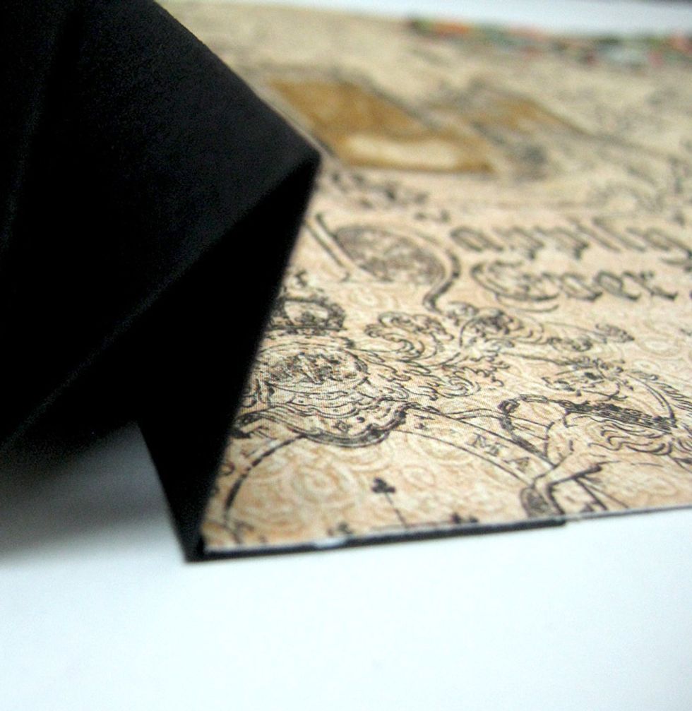 Adhere 8"x8" patterned paper square to last bottom flap of accordion on both sides.