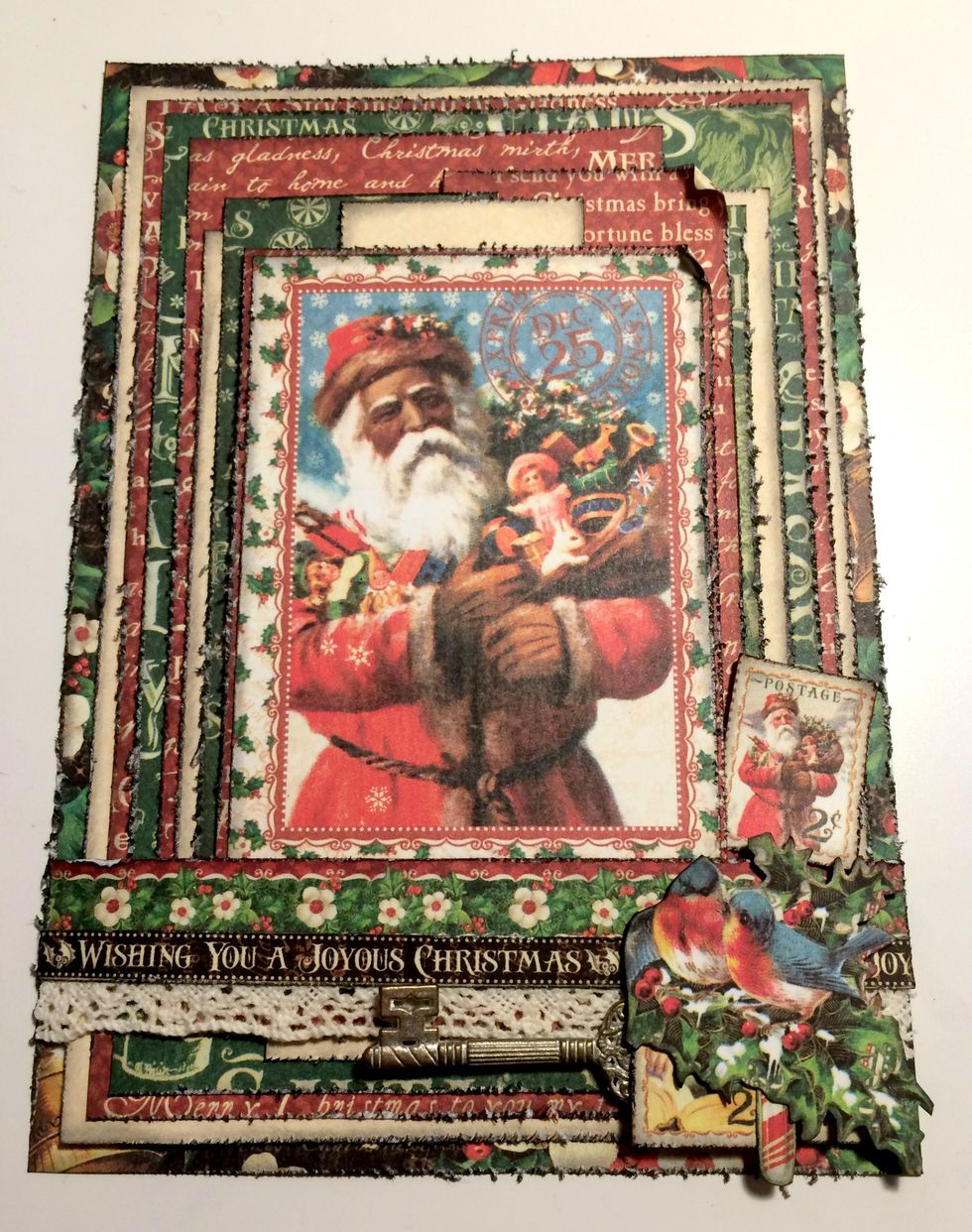 Adhere a candy cane to the right of the bottom stamp. Note: I decided not to add the birds in the holly in between the two stamps on my final card.