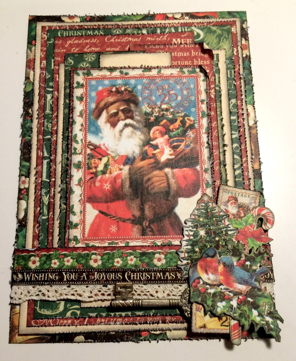 Adhere a candy cane to the right of the top stamp. Note: I decided not to add the Christmas Tree in the final card.