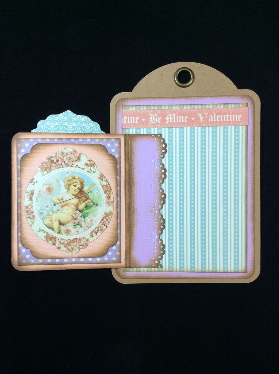 Adhere a chosen image in the inside of the hinge cover. I used a sticker from the sticker sheet mounted on card stock and corner comped.