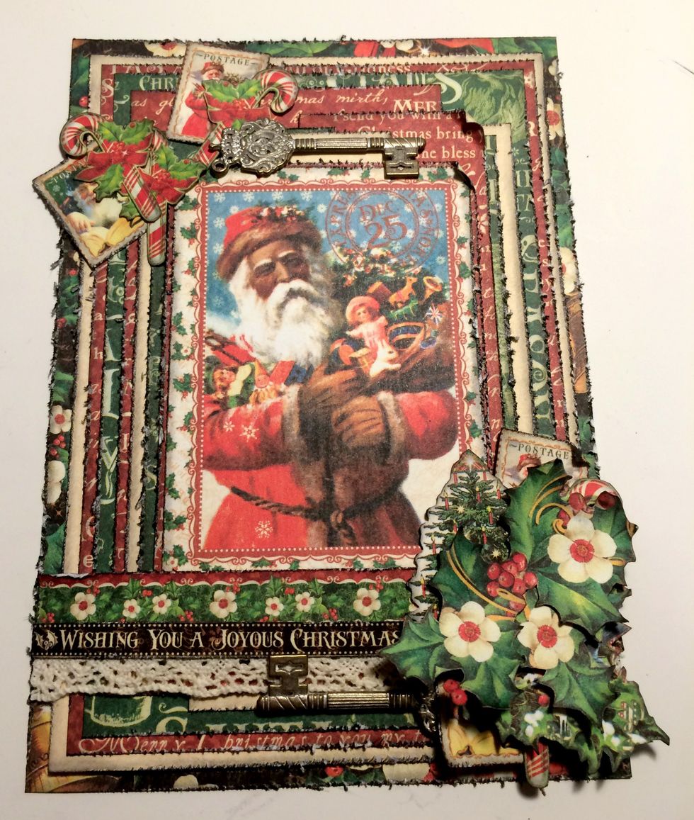 Adhere a key 1 1/2" from left of the flower paper. Adhere a candy cane to the right of top stamp. Adhere a candy cane to the right of left stamp. Adhere a candy cane in the middle of both candy canes.