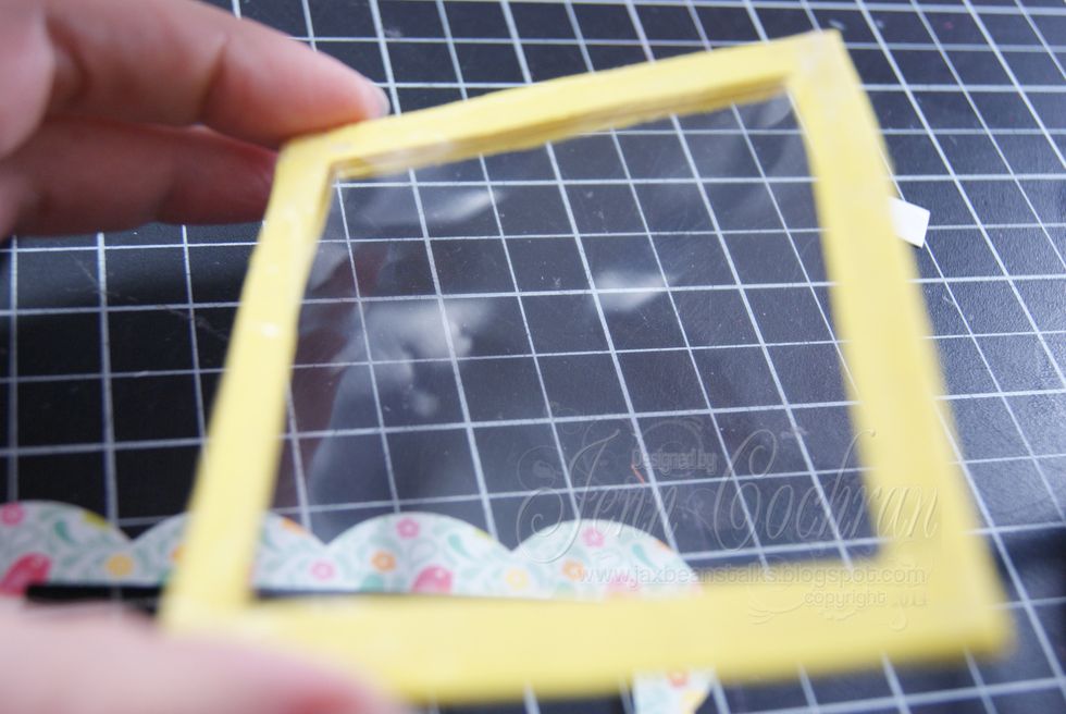 Adhere a piece of acetate to the front foam frame.
