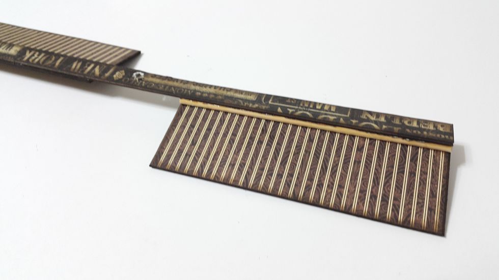 Adhere a sandwich of the 12" chipboard, bamboo sticks and the 5" chipboard on each end, finish all four to form the windmill flags, beware of the directions.