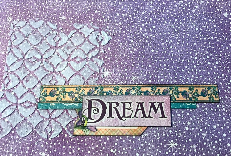 Adhere blue border 1 5/8" from bottom of paper & 2 1/2" from left of paper. Adhere floral border 1/8" over blue border. Adhere arrow 1" from bottom of paper. Adhere Dream tittle in middle of borders.