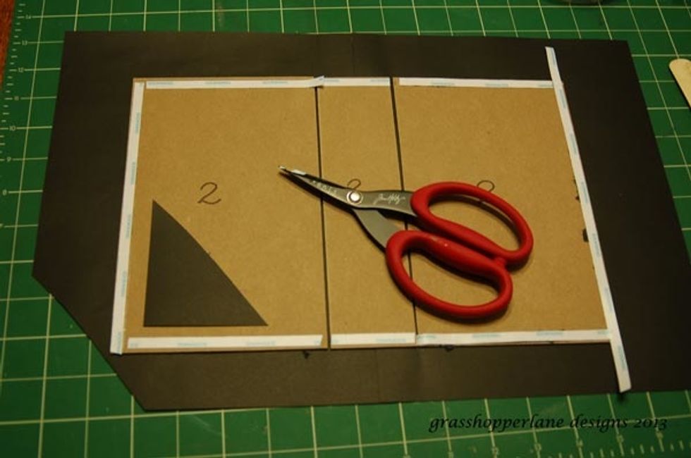 Adhere chipboard pieces to the black cardstock. Make sure to keep everything straight and leave a gap between the spine piece and the covers. Trim off corners as shown.