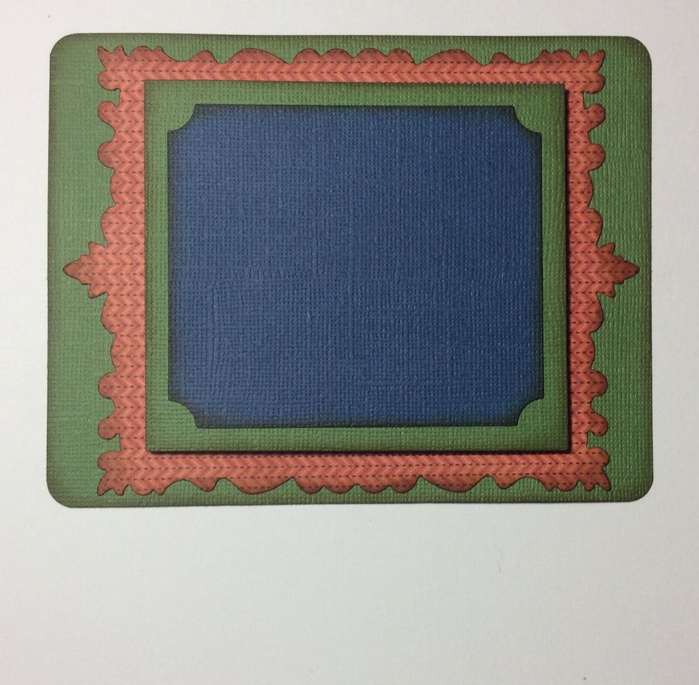 Adhere frame layers into pairs. The larger two then the smaller two using tape. Then adhere the small pair to the large using foam tape.
