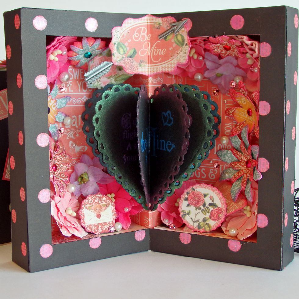 Adhere Heart on the center partition like Sandwich , paste Tim Holtz Industrious Stickers Arrow on "Be Mine"cut out