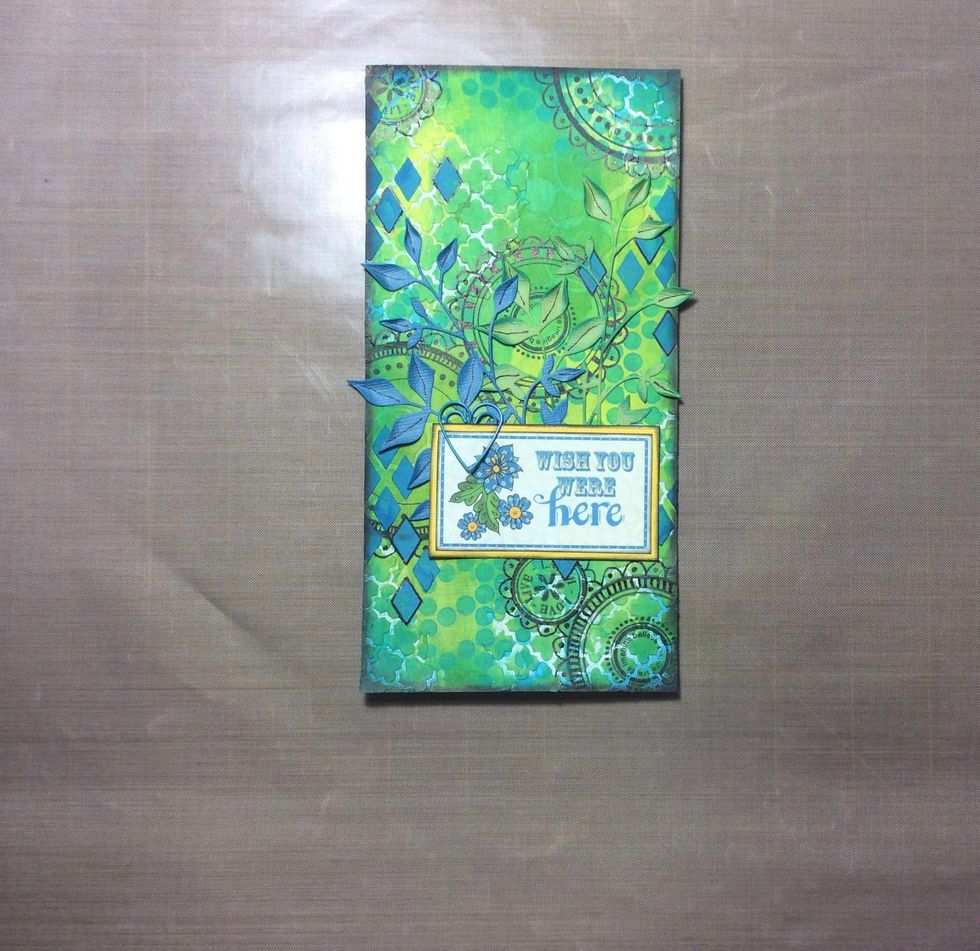 Adhere leaf sprays and sentiment to the background. Add decorative paper clip to the sentiment if desired.