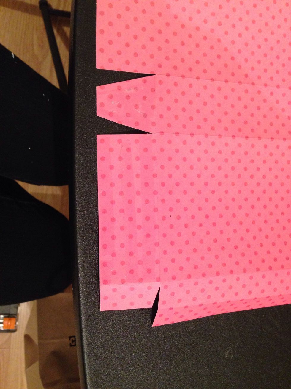 Adhere on the small middle tab and on of the large tabs and adhere the same ones one the other side