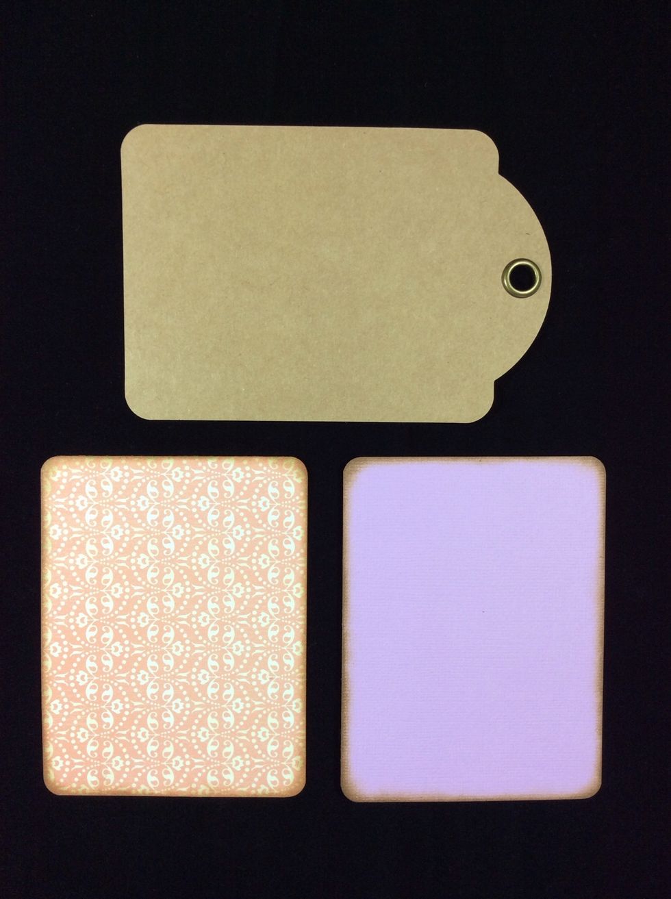 Adhere one to each side of the tag base. Use your chosen type of adhesive.