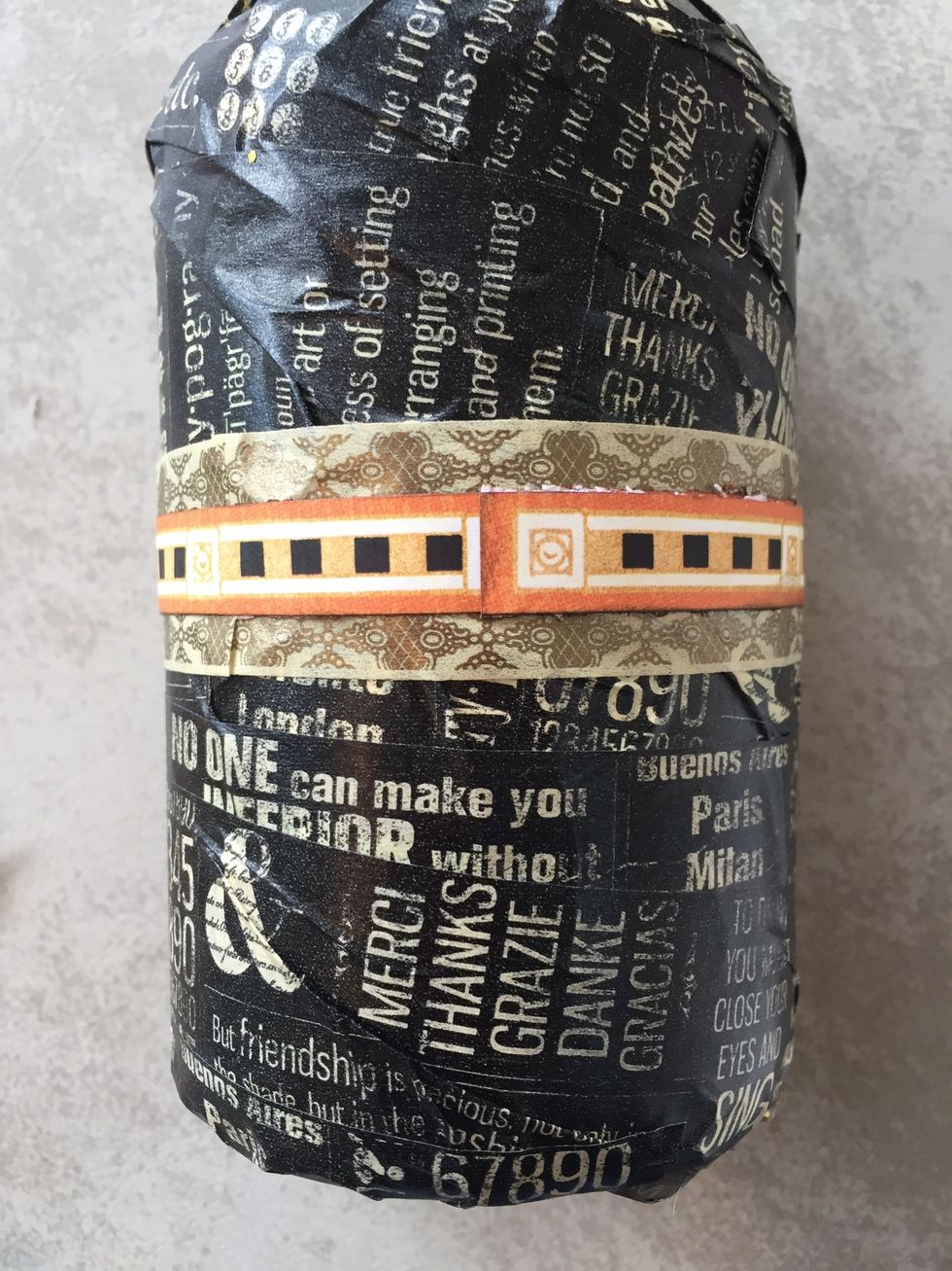 Adhere orange paper strip over washi.