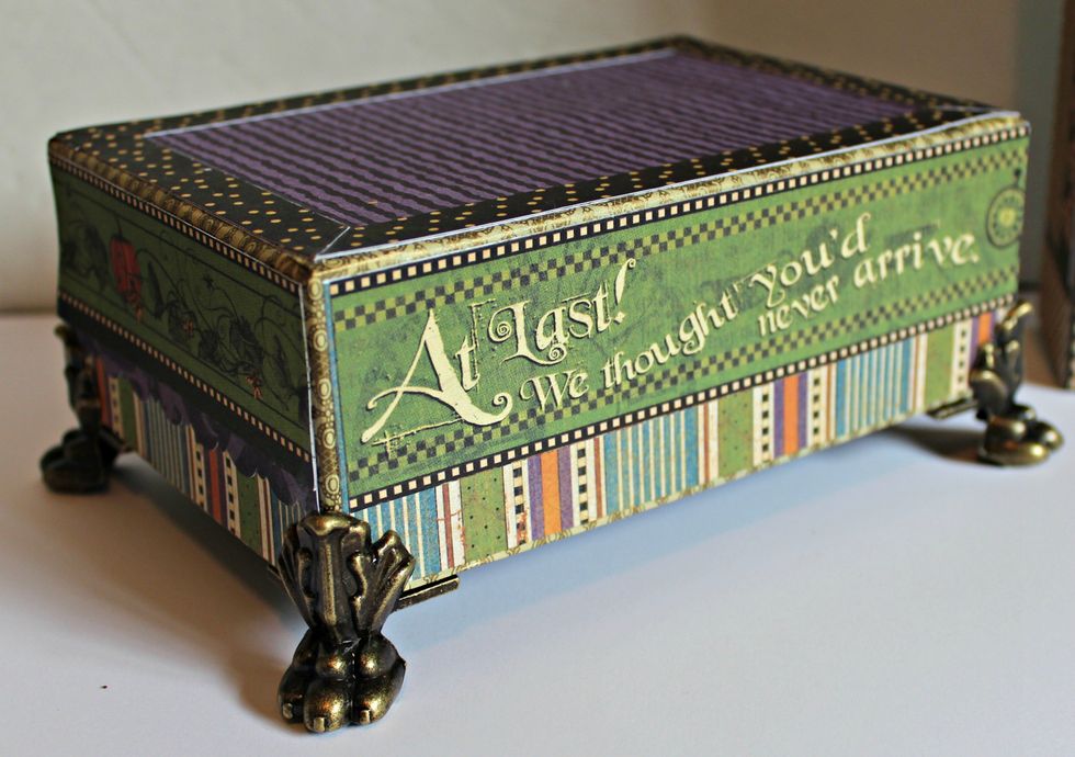 Adhere paper to sides and top of box. Adhere to legs.