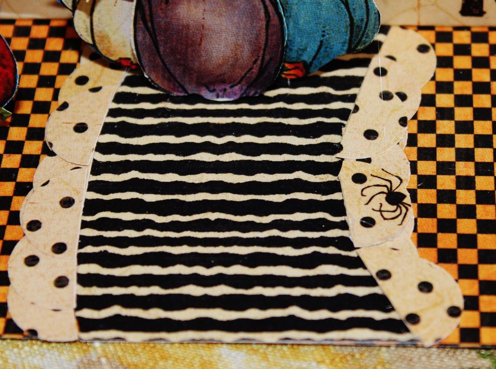 Adhere pattern paper to card; place 1/2 circles around edge of pattern to form sidewalk.