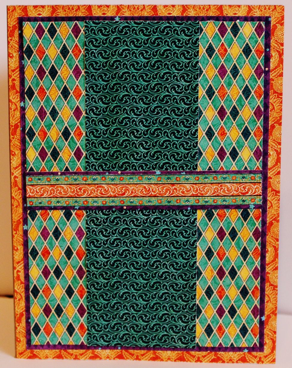 Adhere pattern paper to front of card base.