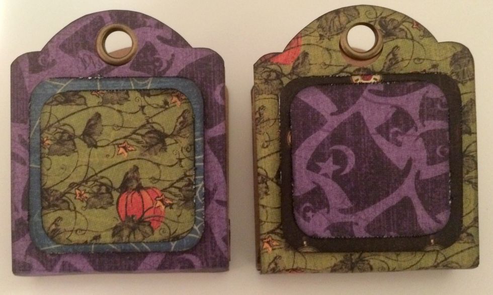 Adhere sm. pumpkin paper to blue cobwebs. Foam square the blue cobwebs piece to middle of purple hat tag. Adhere sm. purple hat piece to clocks. Foam square clock piece to middle of pumpkin tag.