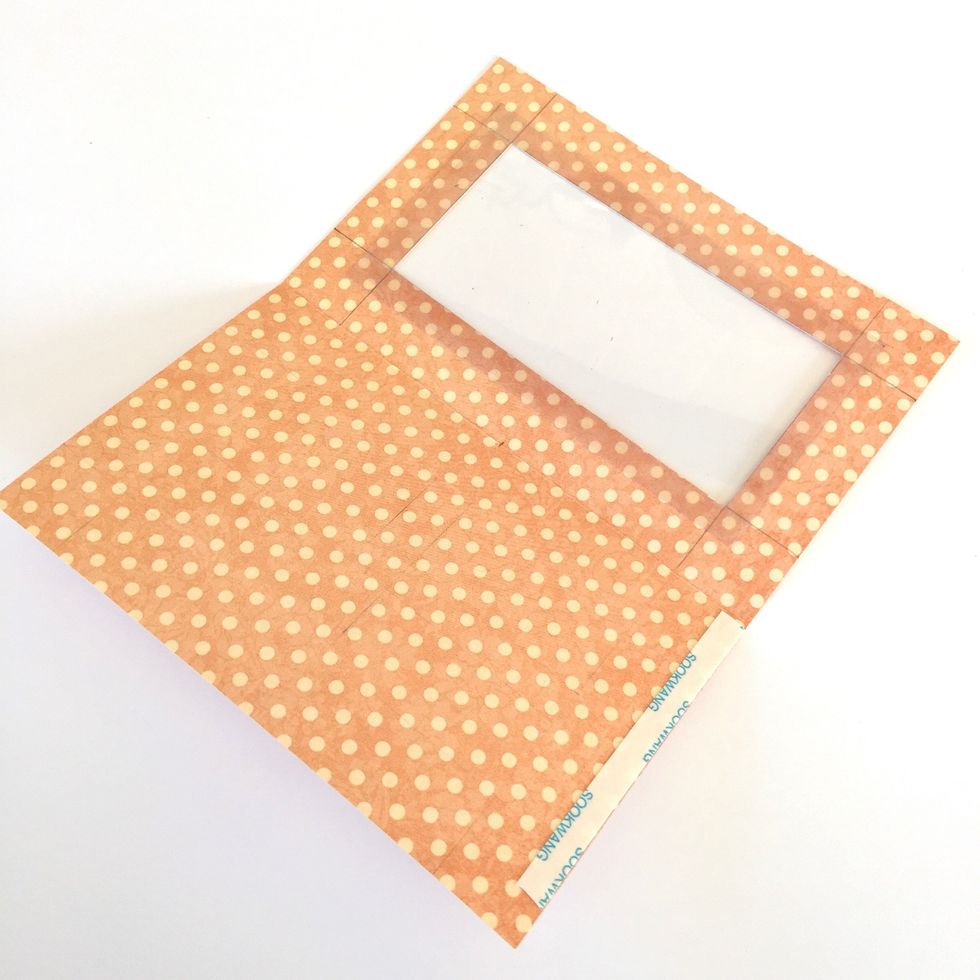 Adhere some acetate and put double sided tape as shown.