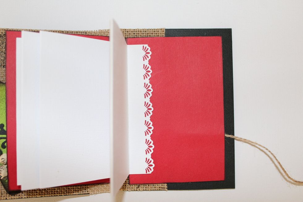 Adhere some twine or ribbon to the inside of the back cover, then, join the right red cover.