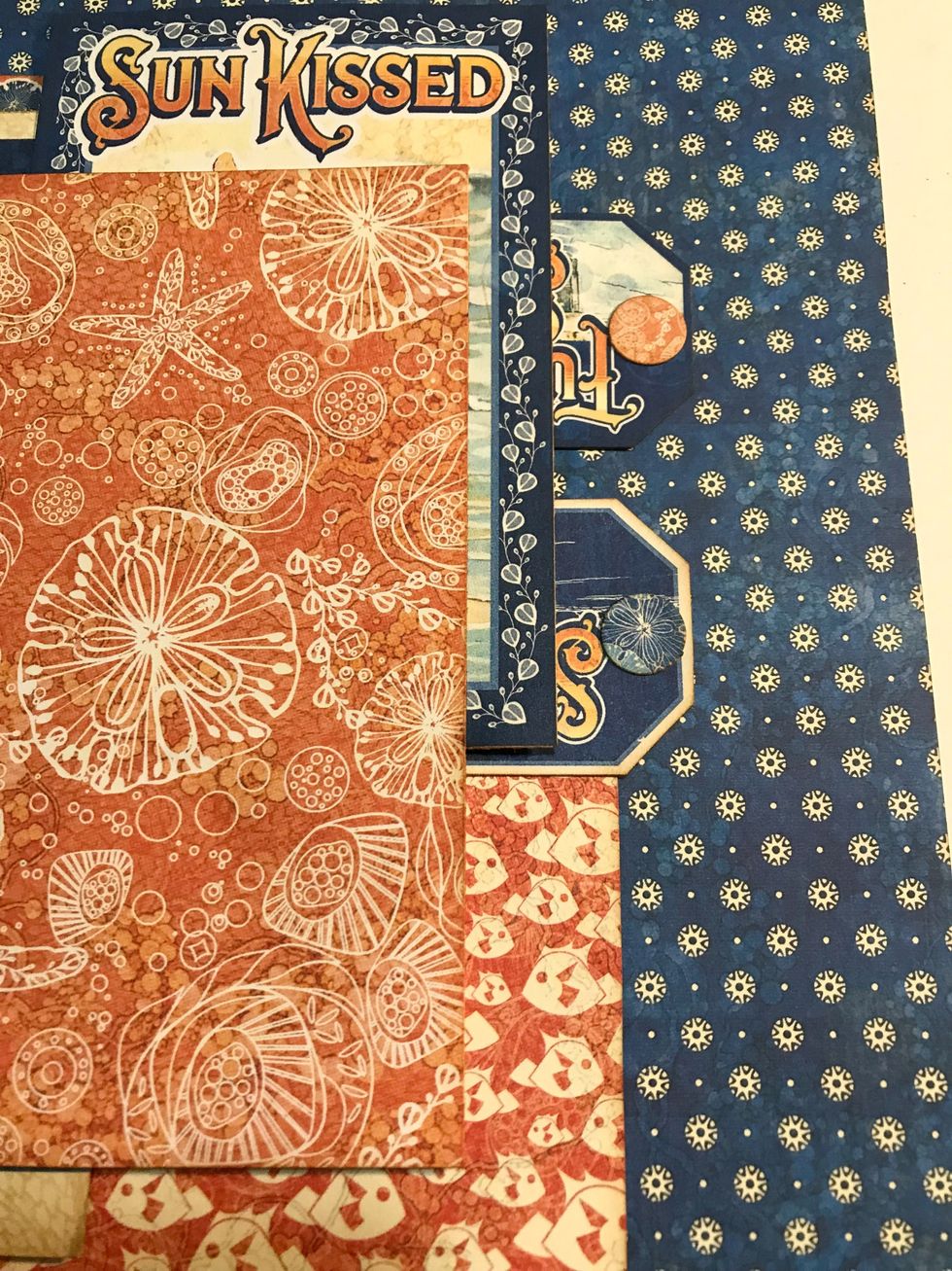 Adhere tag #1- 1/8" from right & 2 1/2" from top of paper. Adhere tag #2- 1 3/8" from right & 4 1/2" from top. Adhere the circles to the top of the tags.