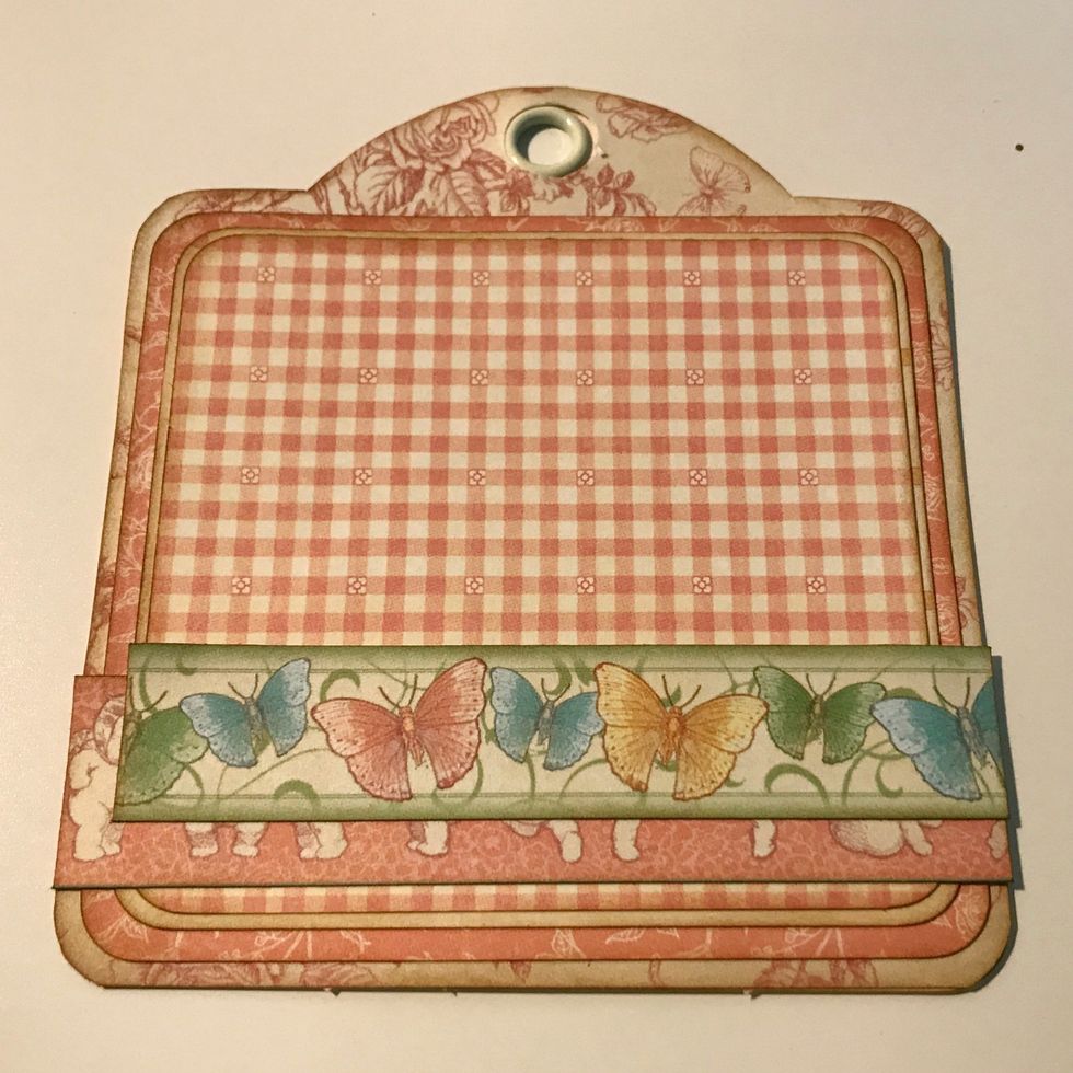 Adhere the 4 1/2" border a 1/2" from the bottom of the tag. Adhere the 4 1/4" border 1" from the bottom of the tag.