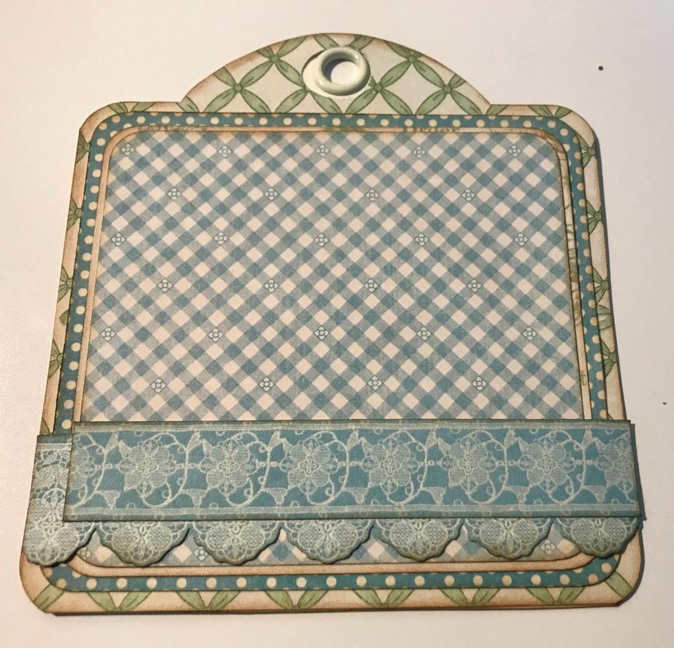 Adhere the 4 1/2" border a 1/4" from the bottom of the tag. Adhere the 4 1/4" border 5/8" from the bottom of the tag.