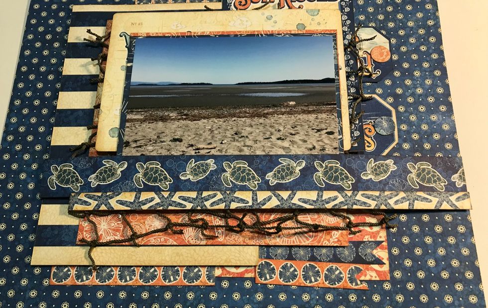 Adhere the 9" border 4" from the bottom of the paper. Adhere the 8 1/2" border 3 1/2" from the bottom of the paper. Adhere the two banners 4 7/8" from right & 2 1/2" from the bottom of the paper.