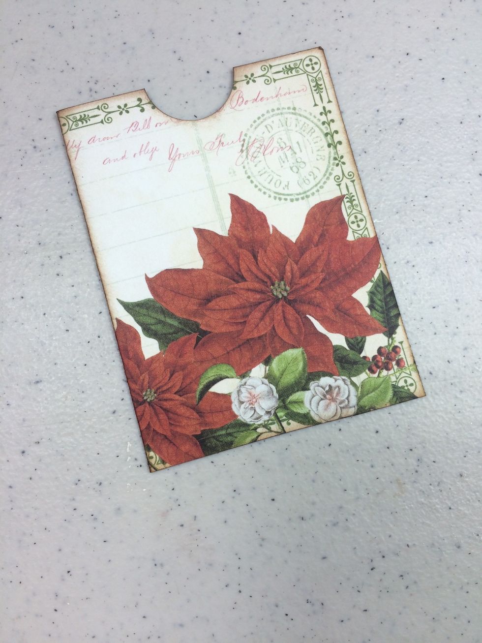 Adhere the bottom and right side to create a pocket. Use a 1" circle punch to notch out a half circle, as shown. Ink edges.