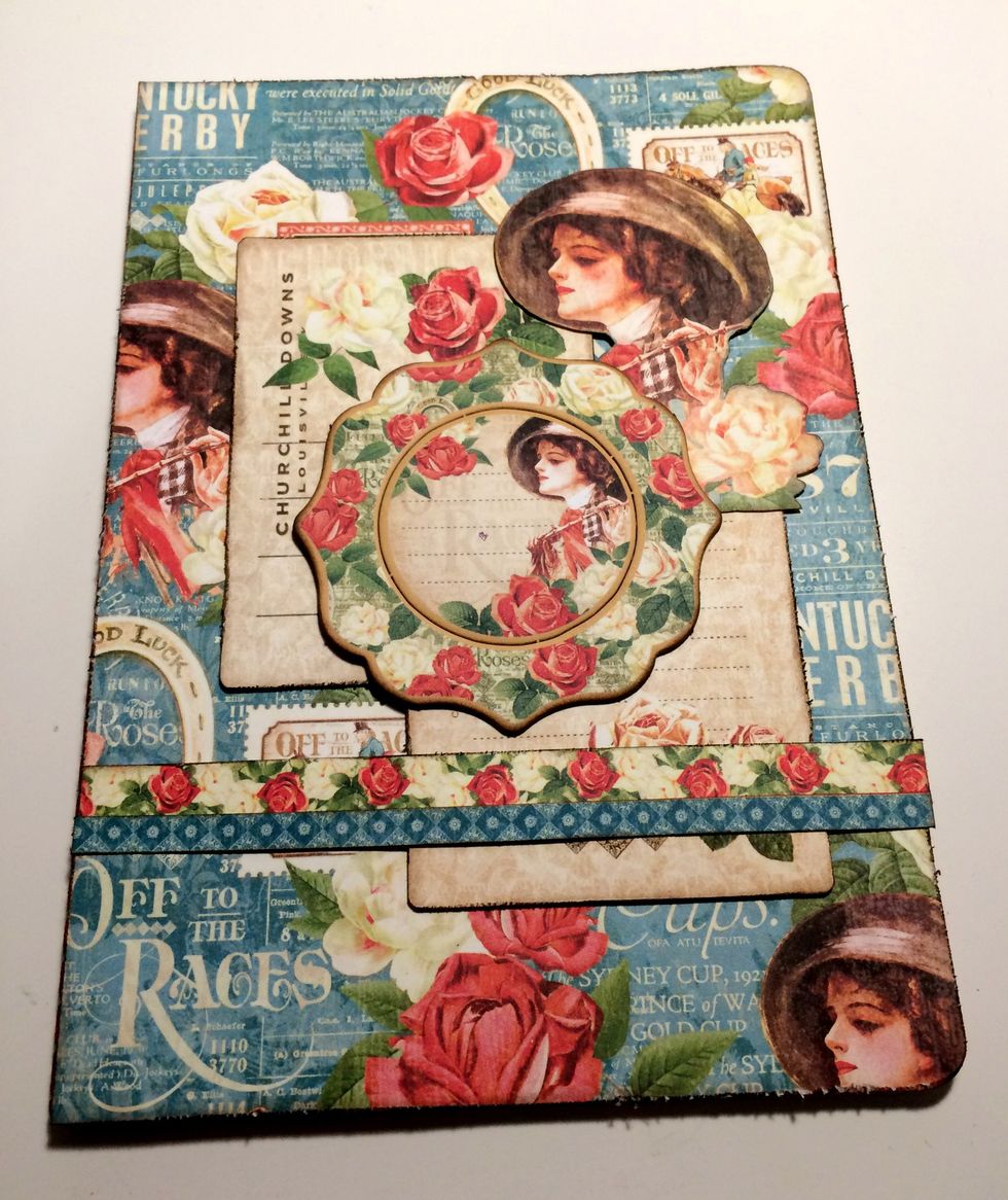 Adhere the chipboard piece in the middle of the journaling cards.