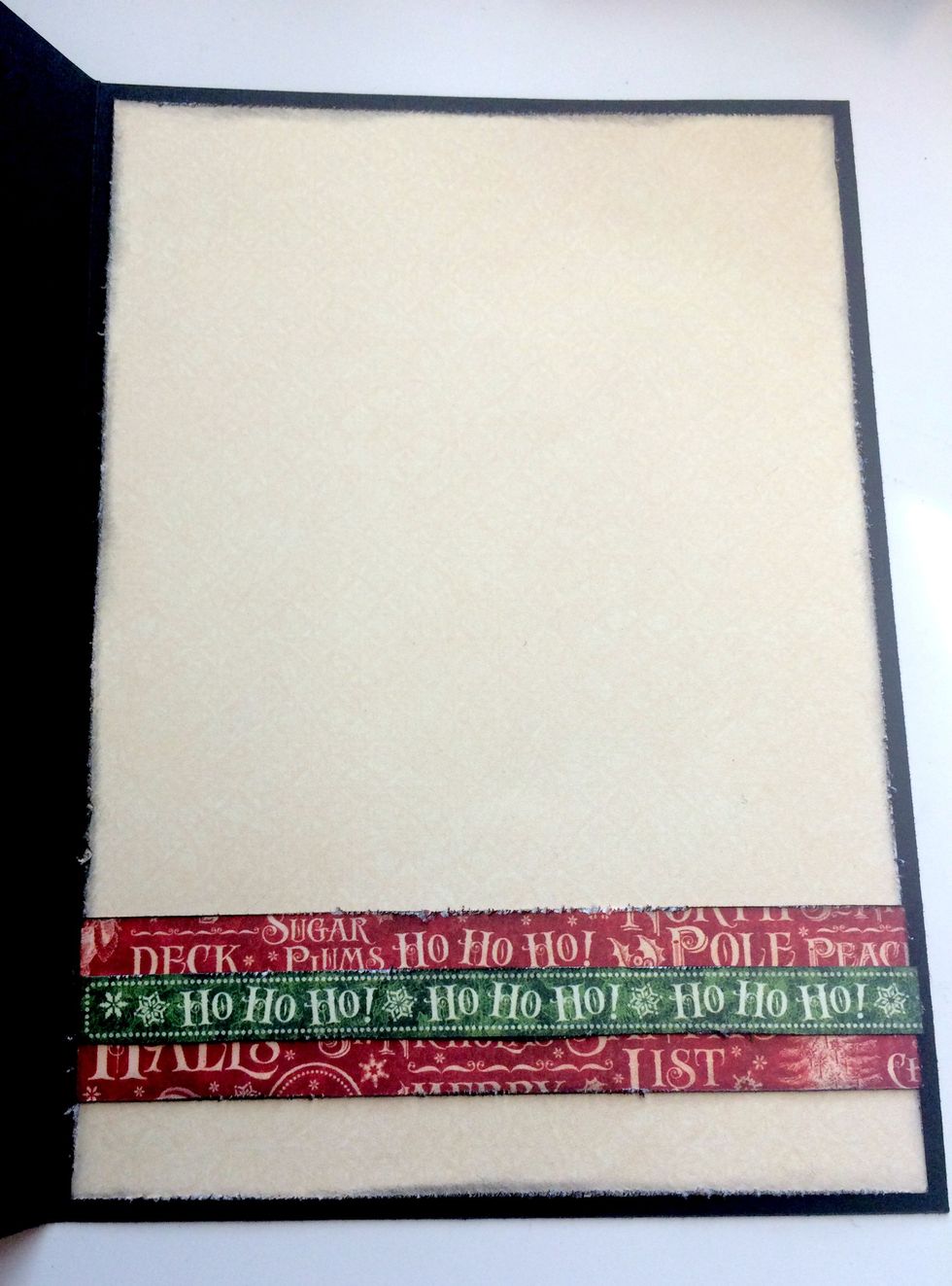 Adhere the cream patterned paper piece to the inside of the card base.