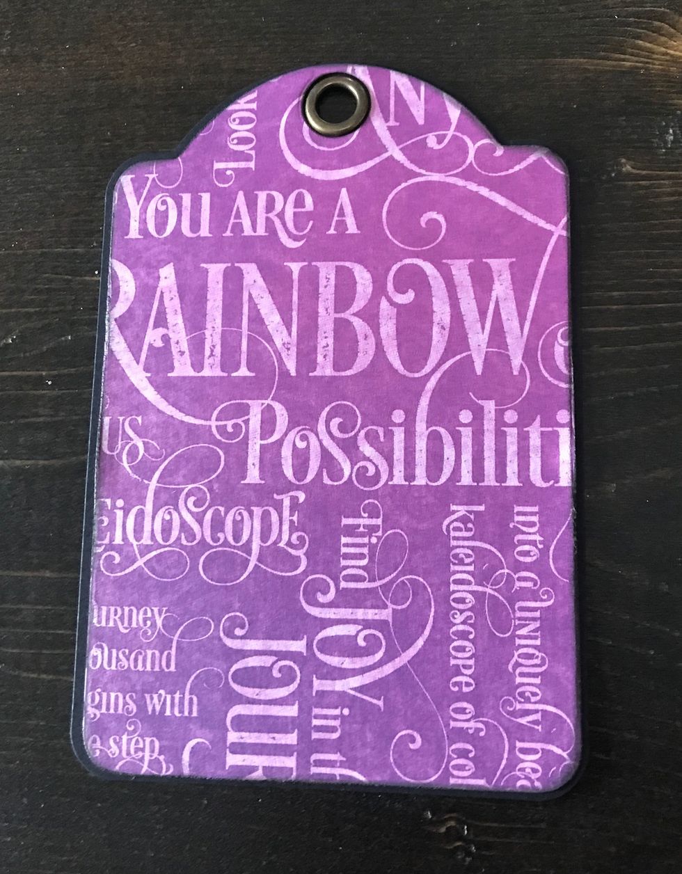 Adhere the die cut tag to the black tag.