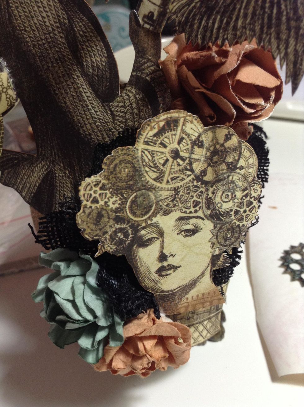 Adhere the elements  to ball front as shown.