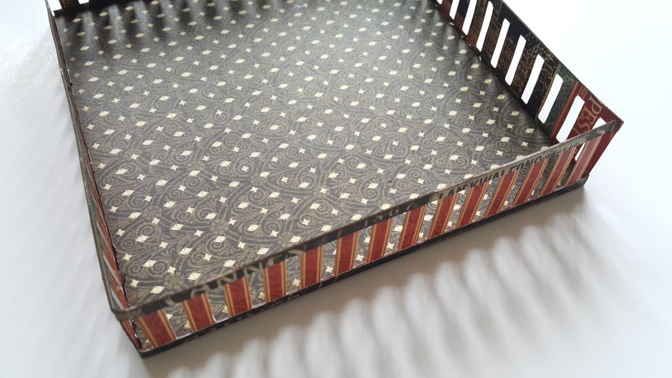 Adhere the fence onto the 5" square chipboard piece.