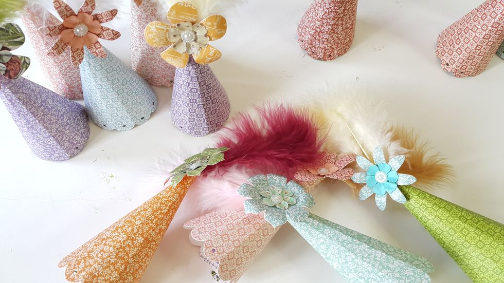 Adhere the flowers on the top on the hat