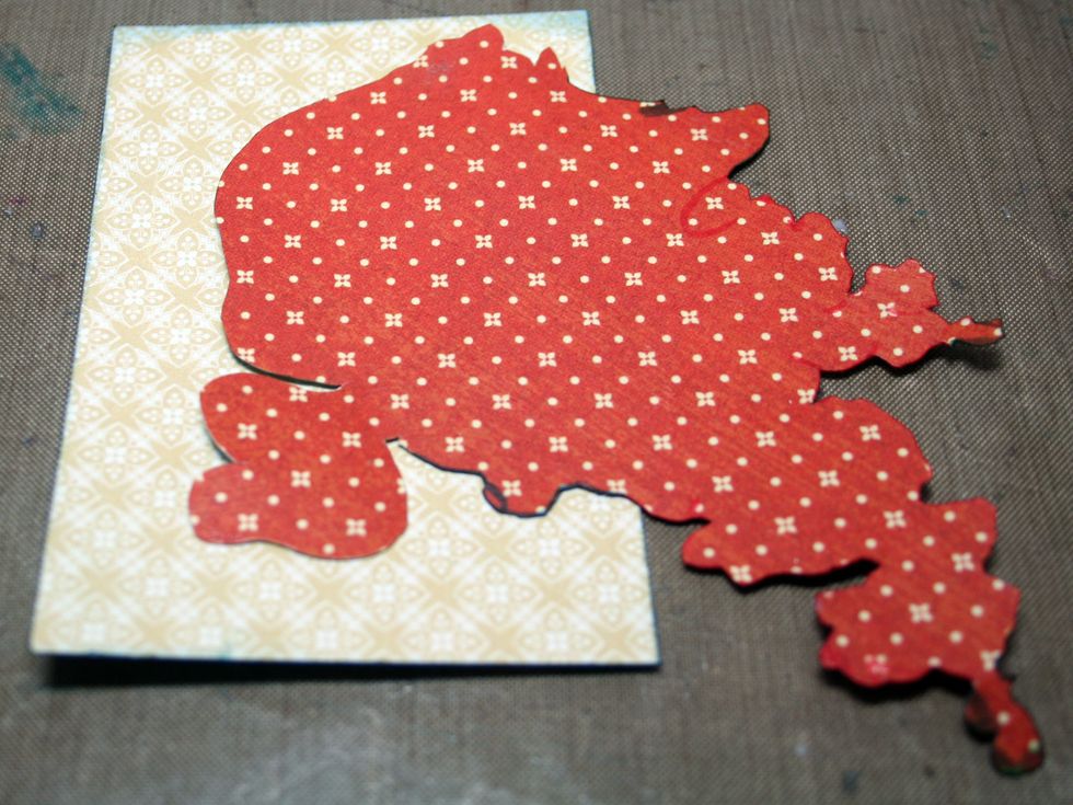 Adhere the flowers to the cut-apart with matte medium.