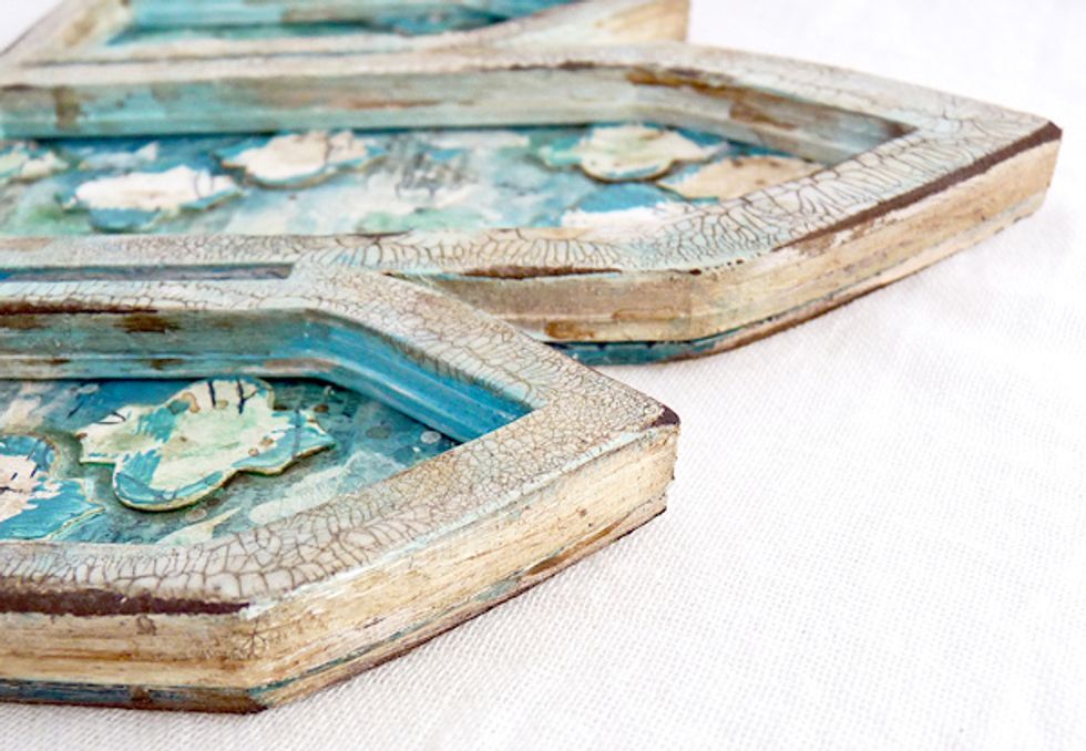 Adhere the frame onto it's background, sand the edges and blend in brown distress ink.