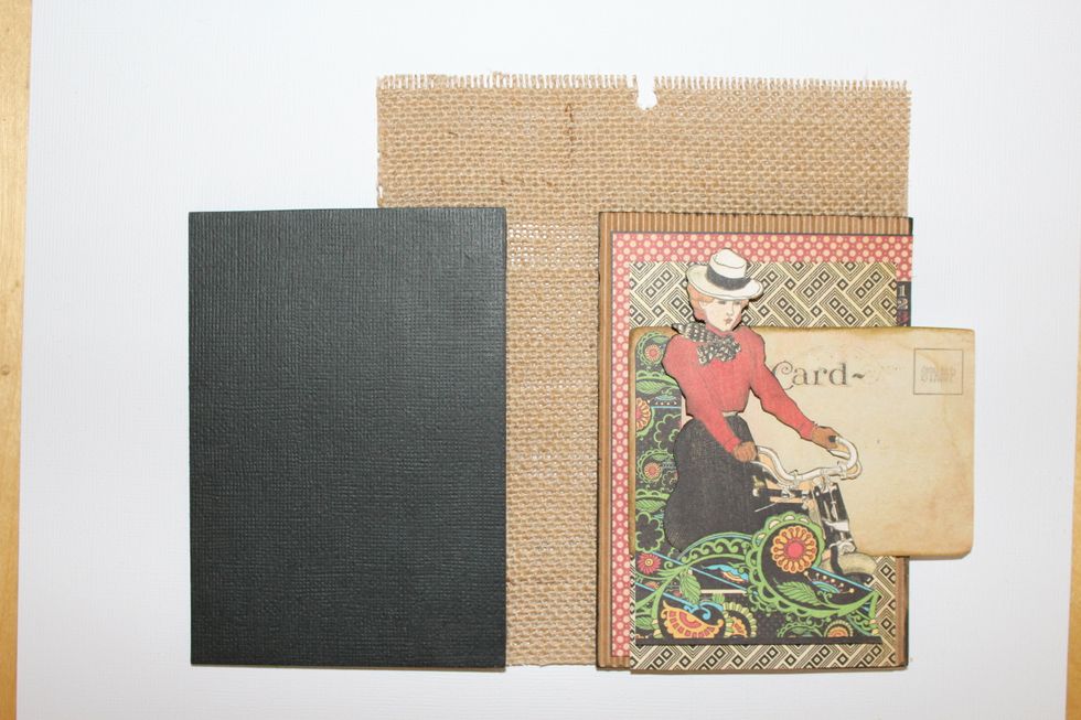 Adhere the front cover on the right side of burlap and the back cover to the left with 1" in between. The stamps are upside down.