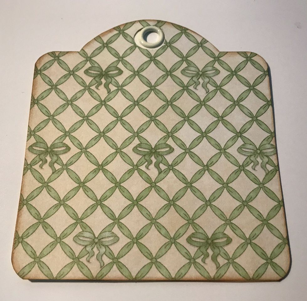 Adhere the green lattice paper tag to the ivory tag.
