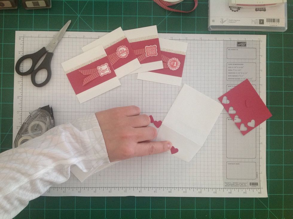 Adhere the heart to the envelope flap, making sure it's right side up when the flap is closed.