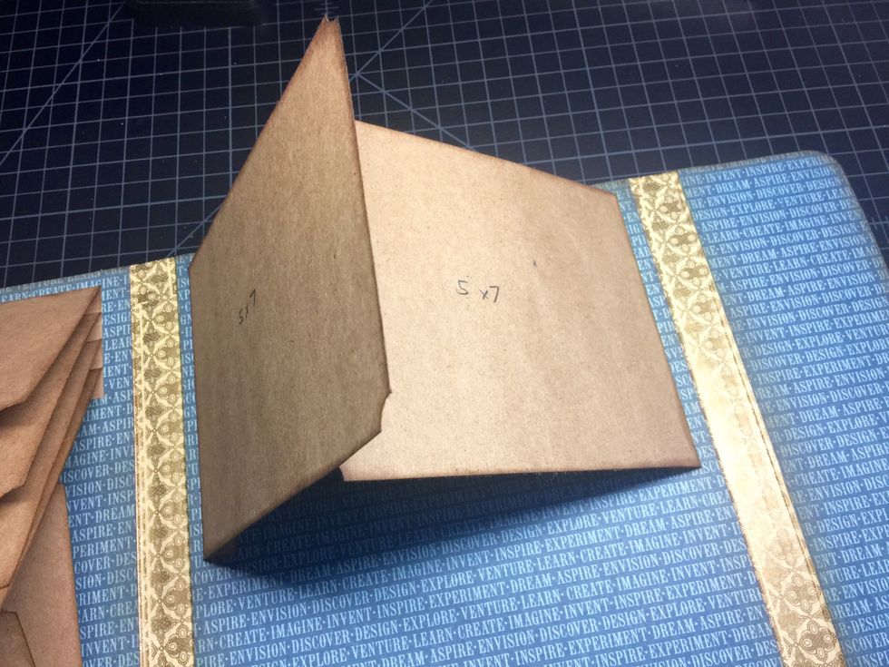 Adhere the largest flaps (5x7) down first as shown.
