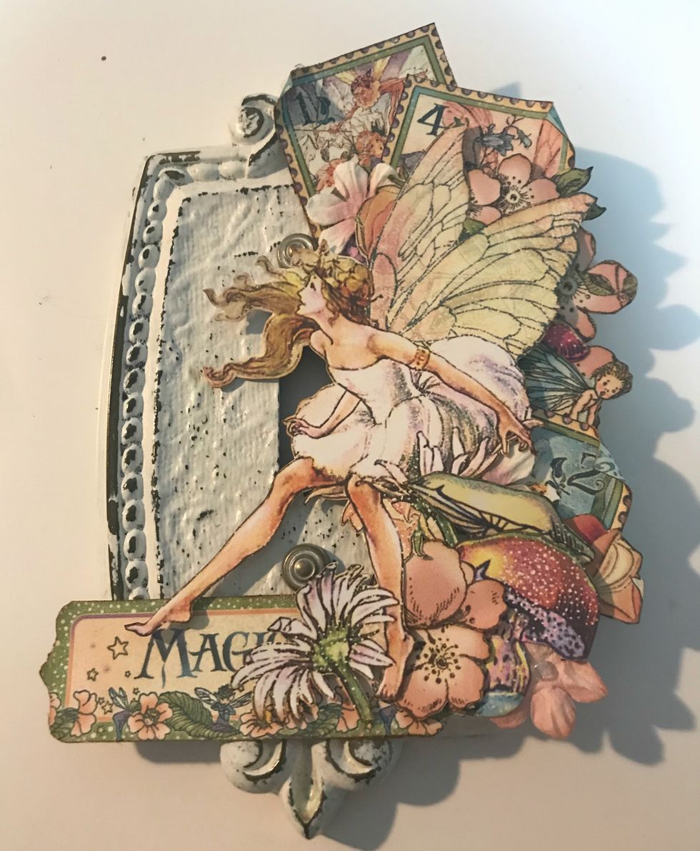 Adhere the Magic tag to the bottom left hand side of the fairy.