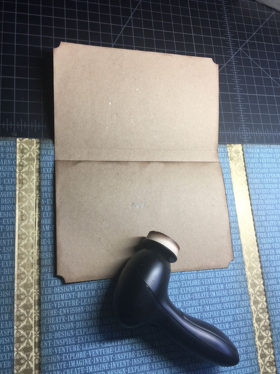 Adhere the next largest flap (5x7) as shown. Line up the top fold with the adhered portion of previous flap. Do this until all flaps are adhered down.