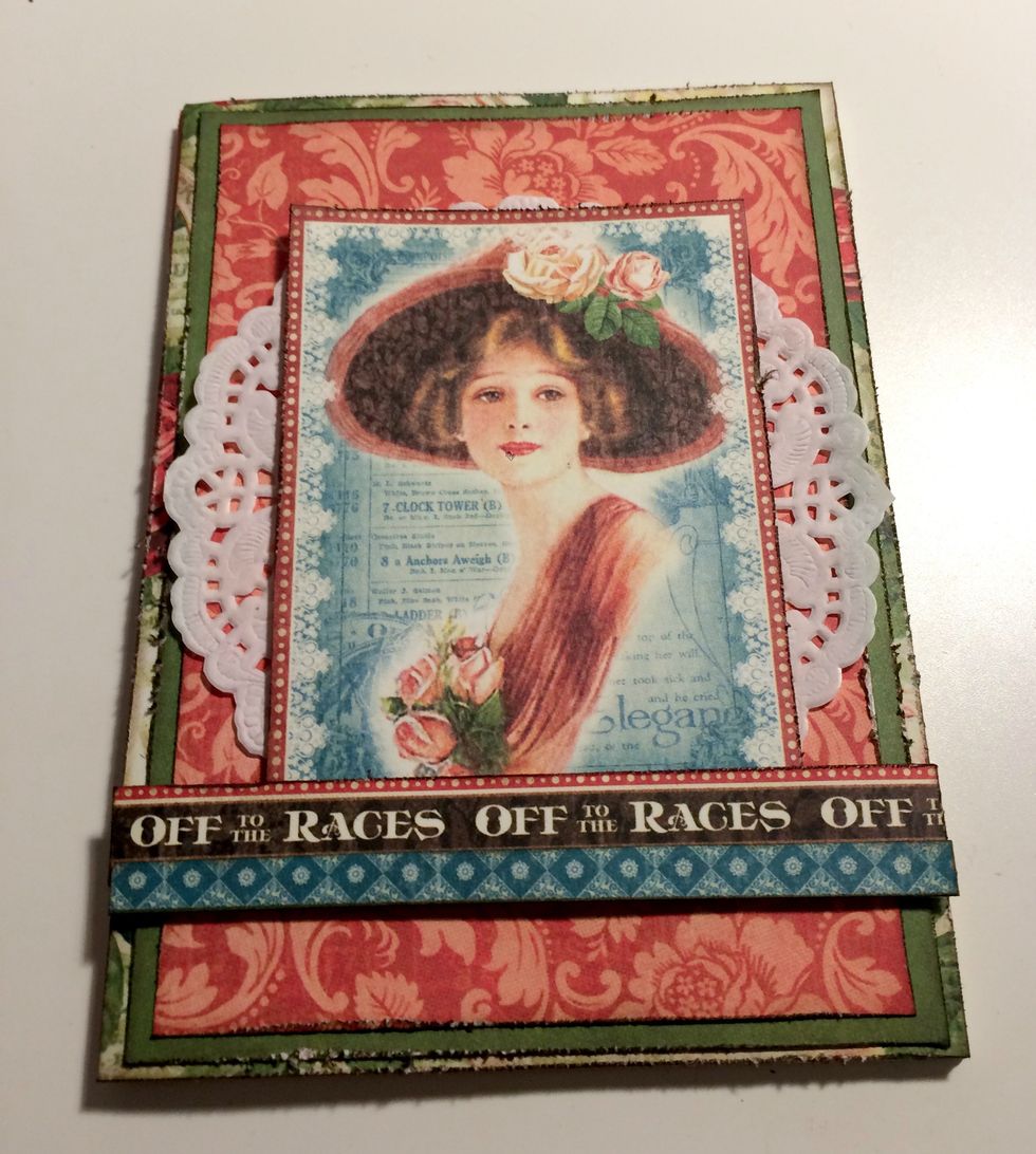 Adhere the Off to the Races border 1/4" from the bottom of the lady. Adhere the blue diamond border slightly over the bottom of the Off to the Races border.