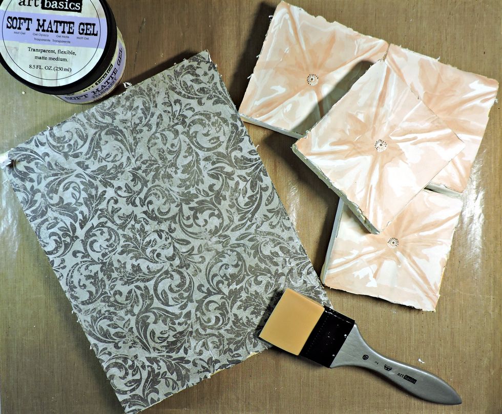 Adhere the paper to the canvas, using Matte Gel.