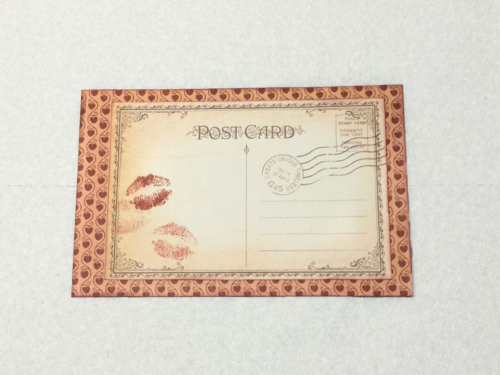 Adhere the post card to the 6" x 3 7/8" design paper rectangle.