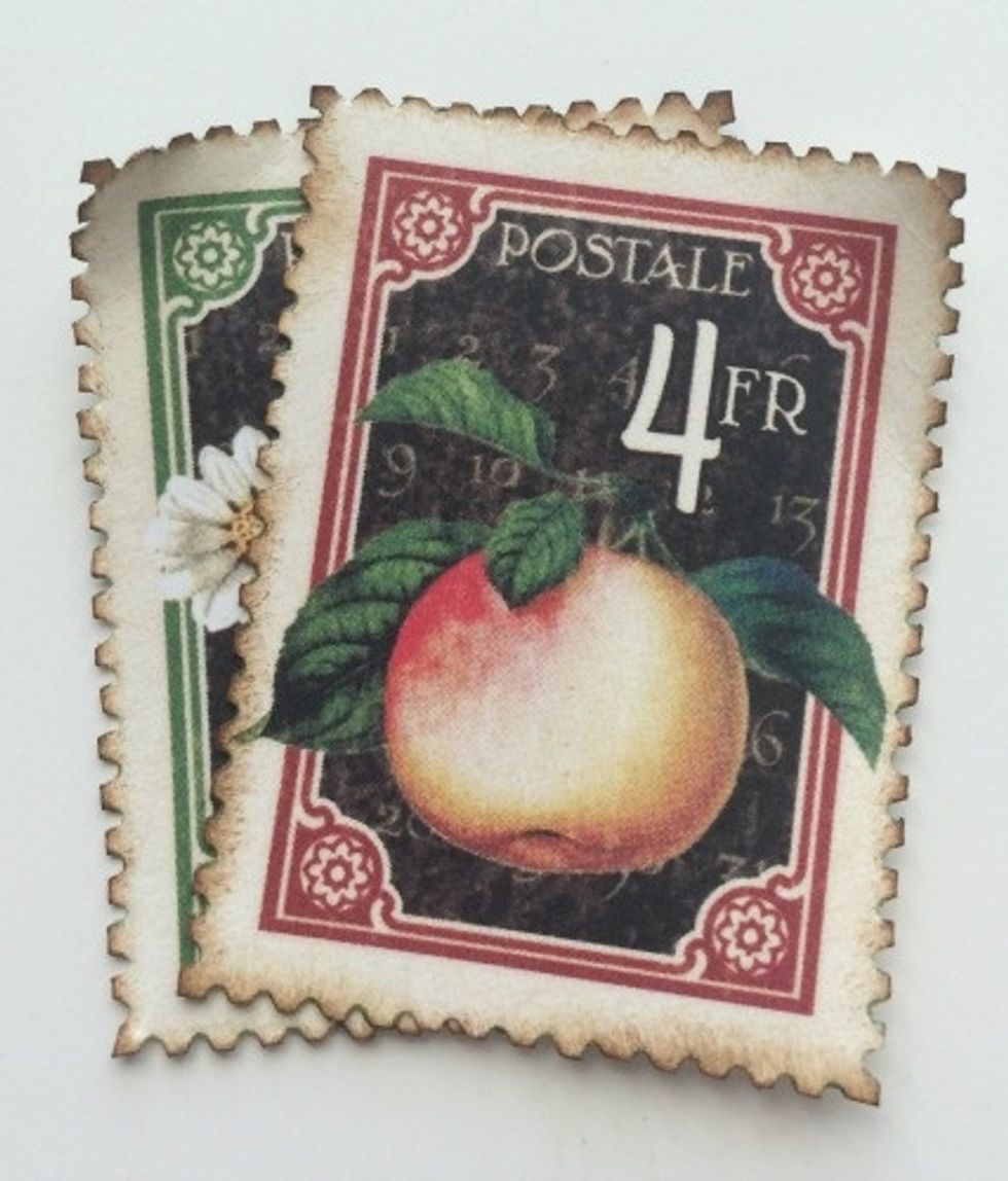 Adhere the postage stamps together. Make sure you can see part of the second postage stamp.