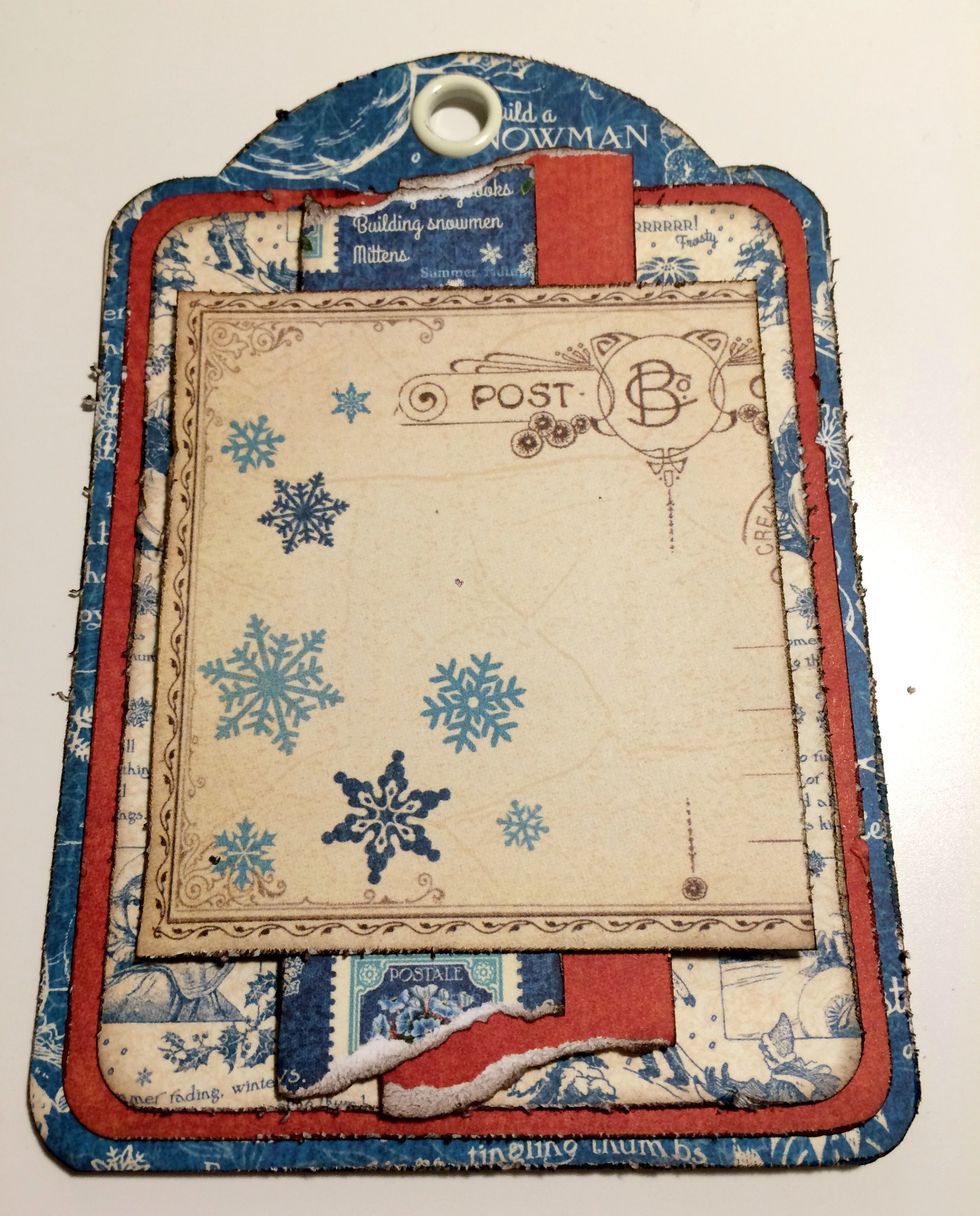 Adhere the postcard to the middle of the tag.