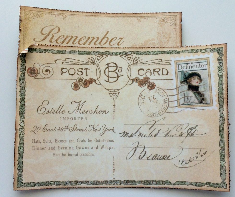Adhere the "Remember" card to the top left hand corner of the postcard. Also curl the top left hand corner down.