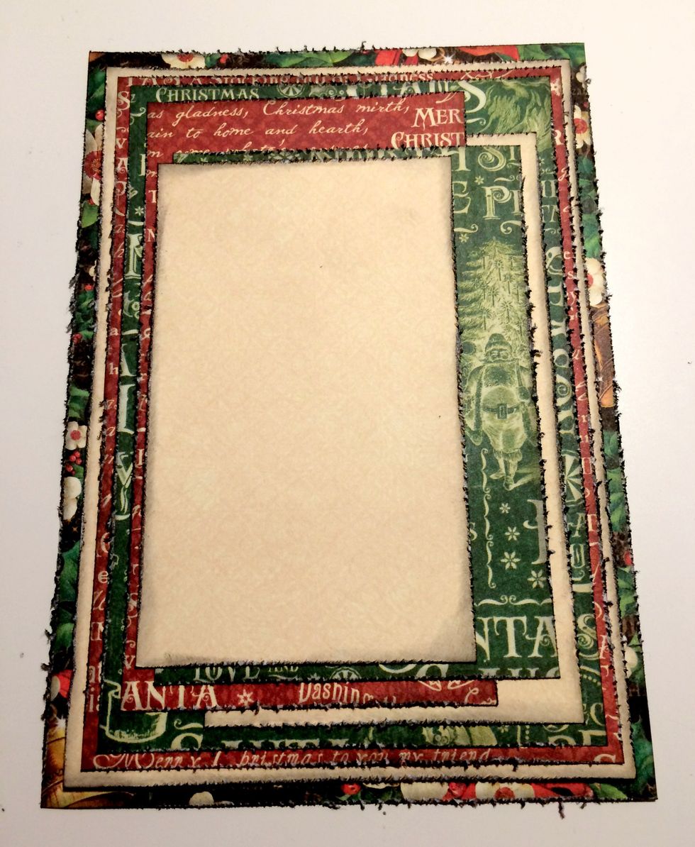 Adhere the small cream patterned paper, 1/8" from the left of the red word patterned paper and 1/4" from the bottom of the green word patterned paper.