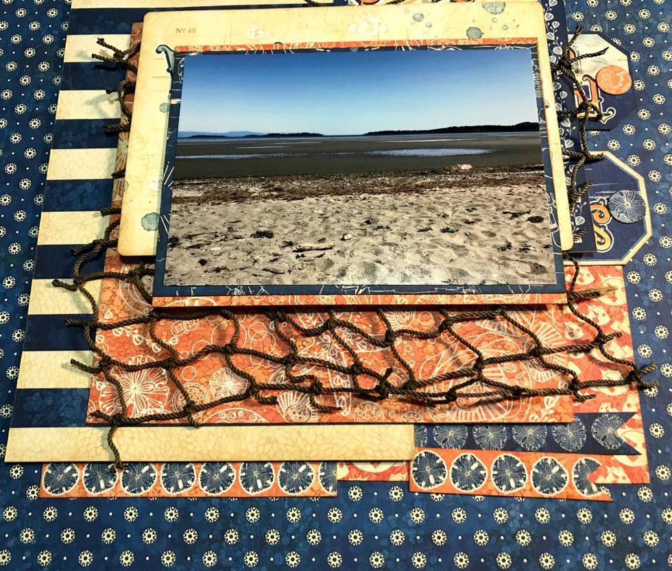 Adhere the small shell paper 2 3/4" from the top & 2 3/4" from the right of the paper. Adhere the small navy paper to the middle of the shell paper. Adhere your photo to the middle of the navy paper.