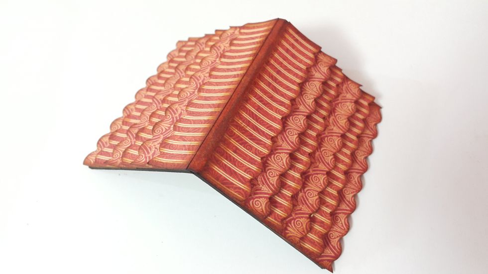 Adhere the strips on the roof until satisfied.